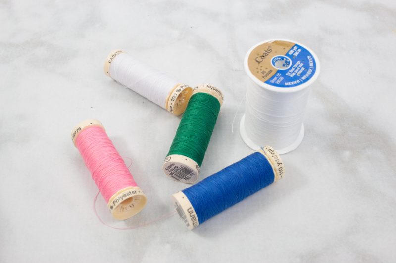 Buy a variety of colored thread when you want to learn to sew