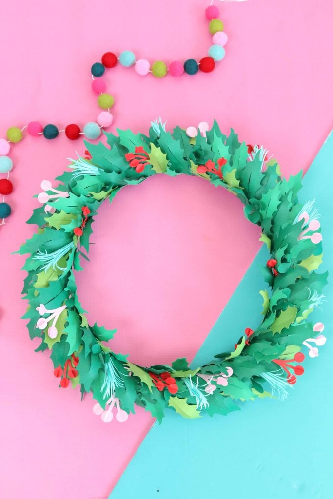 Learn How to Create a Beautiful Christmas Wreath from Cardstock Using a Cricut Machine.