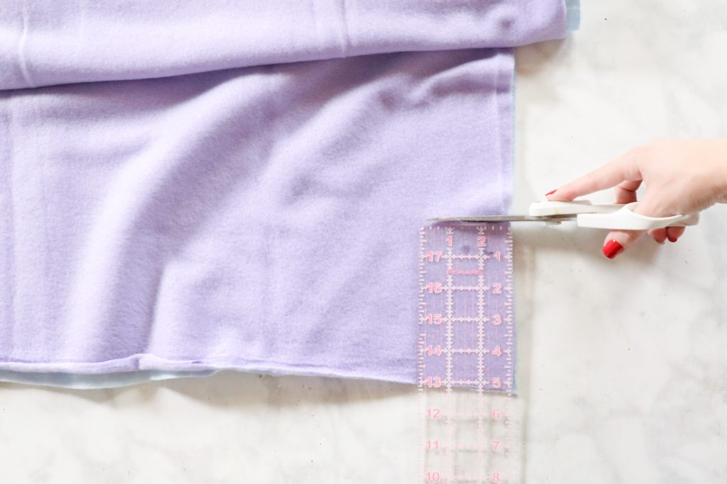 How to Make a No-Sew Fleece  Blanket, a tutorial featured by top US sewing blogger, Sweet Red Poppy.