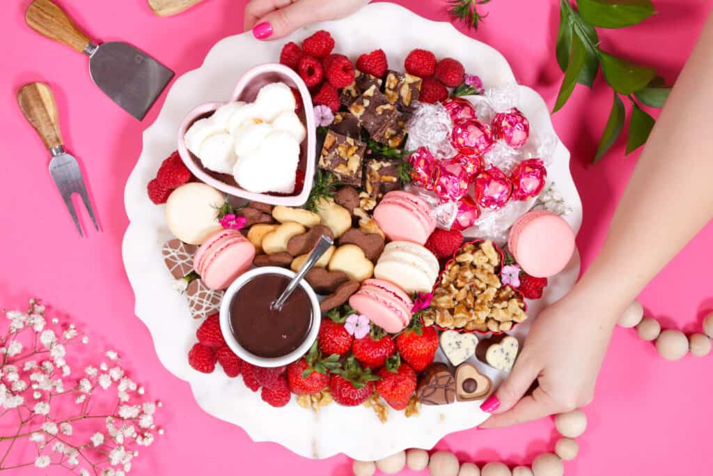 Dessert Charcuterie Board by popular Utah craft blog, Sweet Red Poppy: image of a dessert charcuterie board filled with fruit, cookies, chocolate sauce, chocolate candy, nuts, and macaroons. 