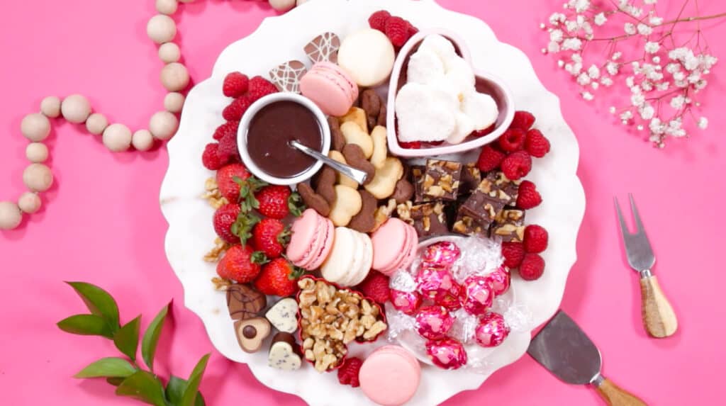 Dessert Charcuterie Board by popular Utah craft blog, Sweet Red Poppy: image of a dessert charcuterie board filled with fruit, cookies, chocolate sauce, chocolate candy, nuts, and macaroons. 