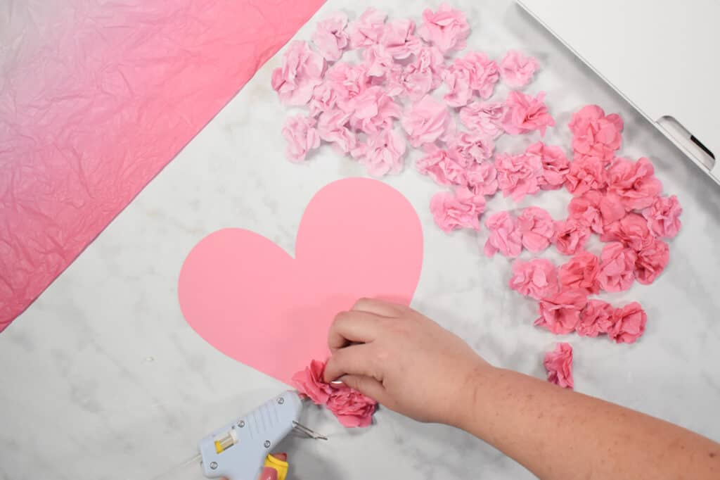 Cricut Shadow Box by popular US craft blog, Sweet Red Poppy: image of  a pink paper heart with paper flowers hot glued on to it. 