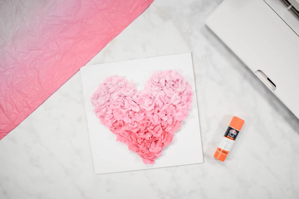 Cricut Shadow Box by popular US craft blog, Sweet Red Poppy: image of  a pink paper heart glued onto a piece of white cardstock. 