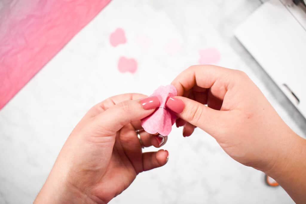 Cricut Shadow Box by popular US craft blog, Sweet Red Poppy: image of  a woman making paper flowers. 