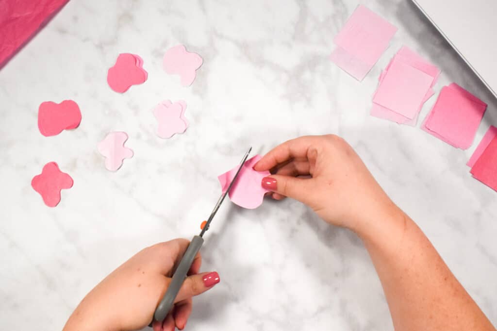 Cricut Shadow Box by popular US craft blog, Sweet Red Poppy: image of  a woman making paper flowers. 