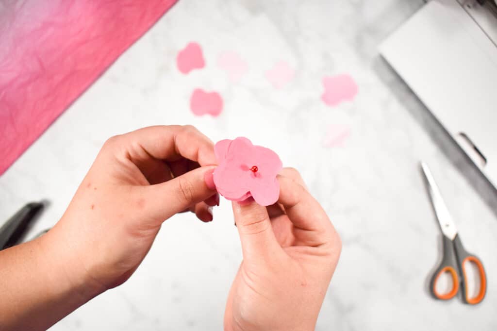 Cricut Shadow Box by popular US craft blog, Sweet Red Poppy: image of  a woman making paper flowers. 