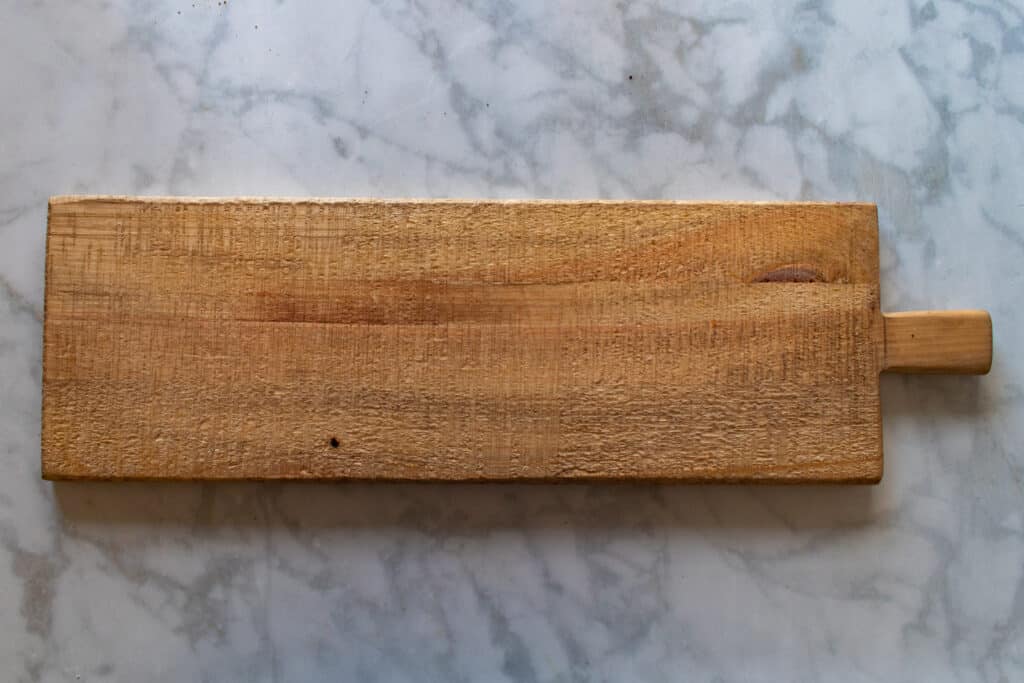 How to Assemble a Charcuterie Board by popular Utah craft blog, Sweet Red Poppy: image of a wooden board. 