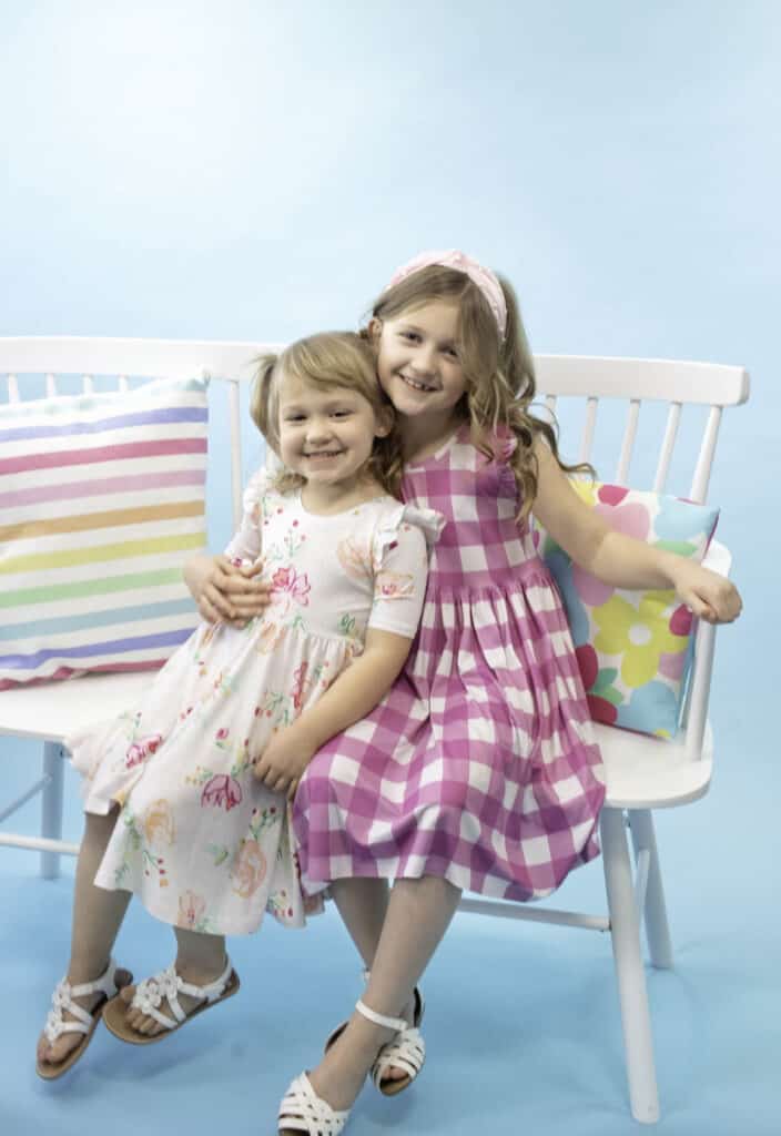 The Madeline Dress from Sweet Red Poppy |Circle Skirt Dress Pattern by popular Utah sewing blog, Sweet Red Poppy: image of two young girls wearing circle skirt dresses. 