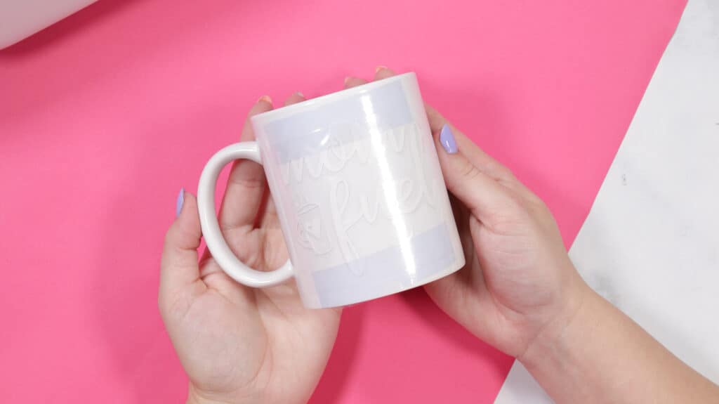 Cricut mug press review featured by top Cricut blogger, Sweet Red Poppy |Cricut Mug Press by popular US craft blog, Sweet Red Poppy: image of a white ceramic mug with heat resistant tape on it. 