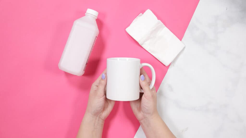 How to Create a Custom Mug with Cricut's Mug Press and Infusible Ink Transfer Sheets, a tutorial featured by top Cricut blogger, Sweet Red Poppy |Cricut Infusible Ink Transfer Sheets by popular US craft blog, Sweet Red Poppy: image of a woman holding a white ceramic mug in her hands. 