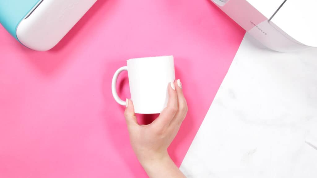 Cricut Infusible Ink Pens by popular US craft blog, Sweet Red Poppy: image of a woman holding a white ceramic mug. 