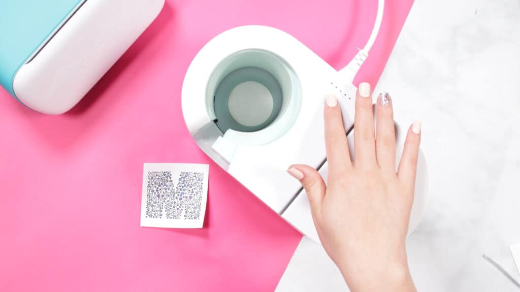 Cricut Infusible Ink Pens by popular US craft blog, Sweet Red Poppy: image of a woman using a Cricut mug press. 