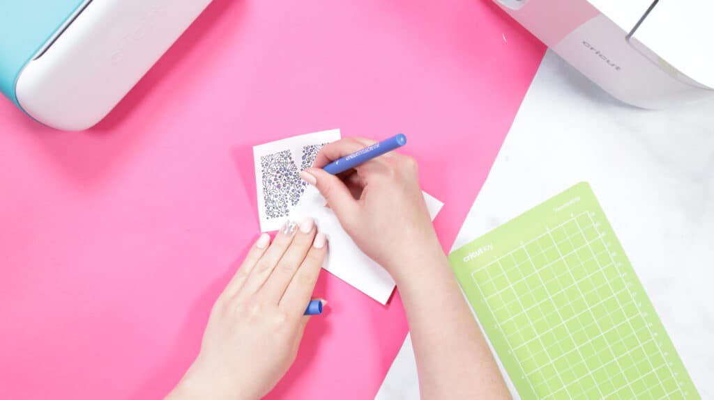 Cricut Infusible Ink Pens by popular US craft blog, Sweet Red Poppy: image of a woman using a Cricut Infusible ink pen. 