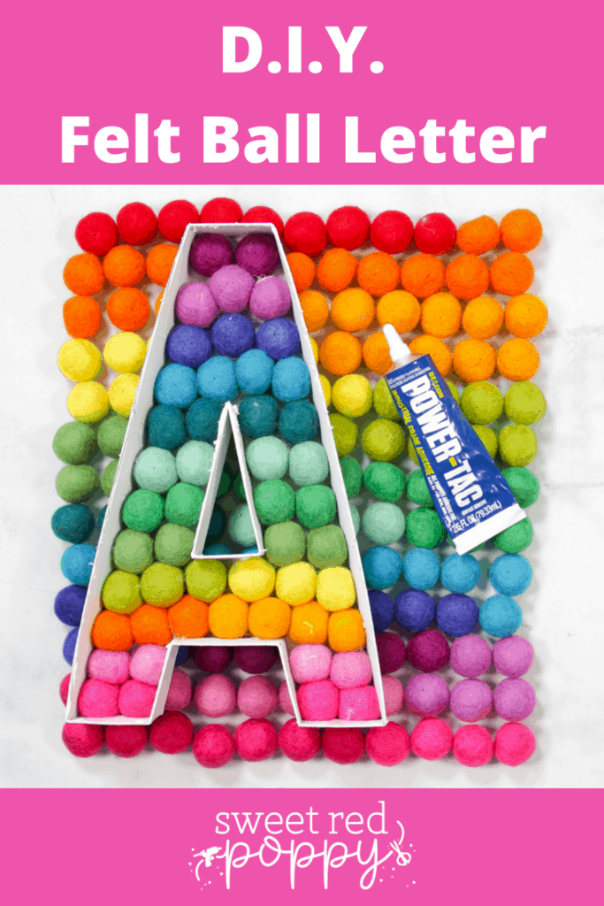 Felt Ball Letters by popular US craft blog, Sweet Red Poppy: Pinterest image of a white cardboard letter A filled with rainbow felt balls. 