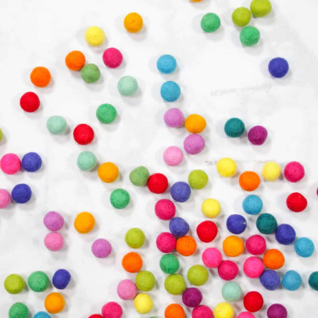 Felt Ball Letters by popular US craft blog, Sweet Red Poppy: image of rainbow felt balls. 