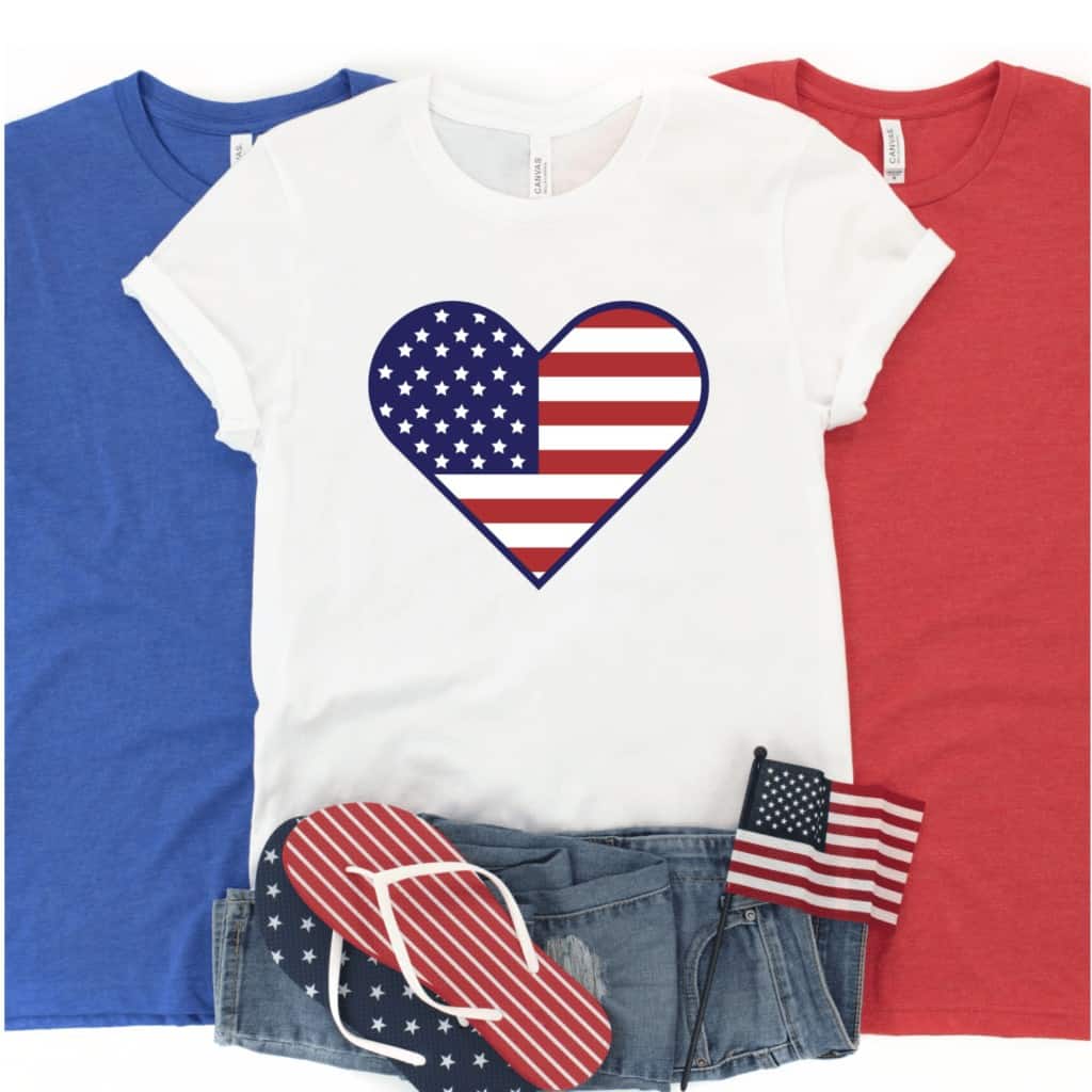 Free SVG Cut Files by popular US craft blog, Sweet Red Poppy: image of a blue, red, and white t-shirt with a Stars and Stripes heart iron on next to a pair of jean shorts, Stars and Stripes flip flops, and mini American flag. 