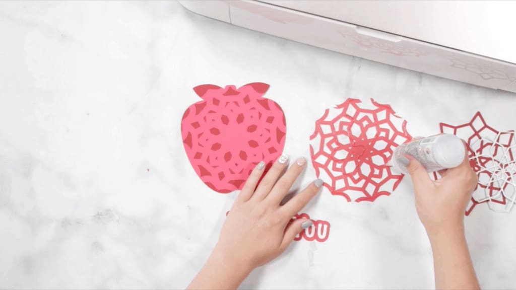 Apple Mandala by popular US craft blog, The Sweetest Thing: image of a woman assembling a layered apple mandala. 