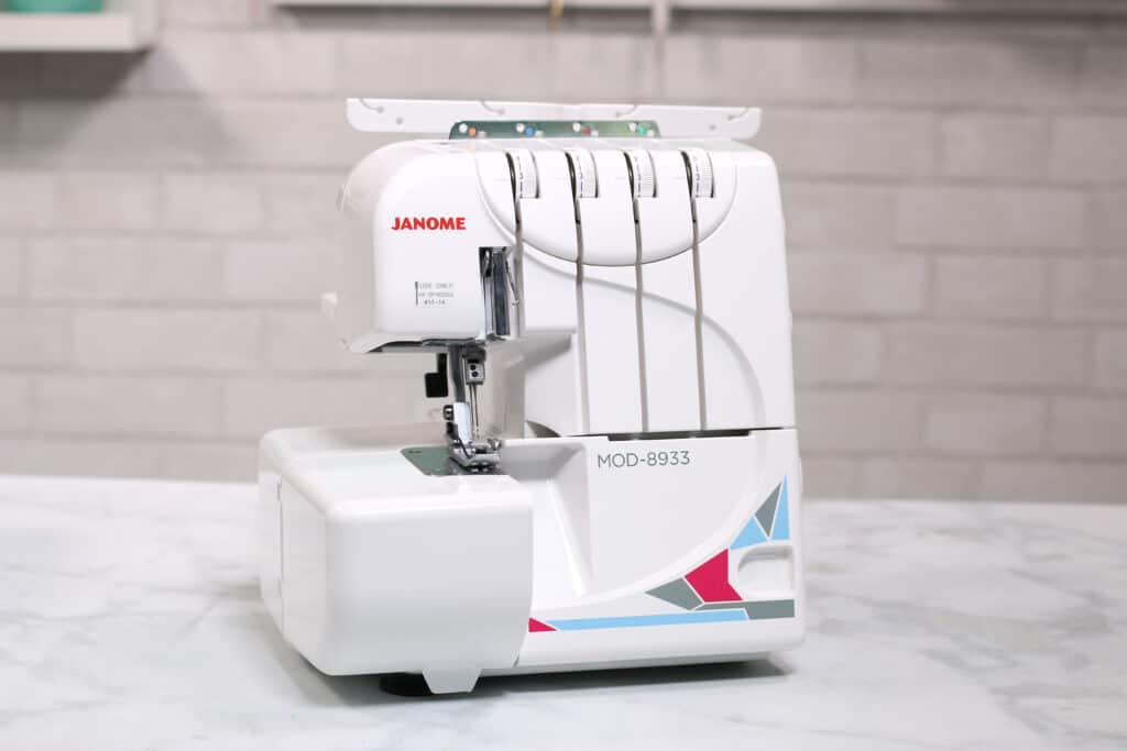 Janome MOD-8933 Serger Machine | Serger VS Sewing Machine by popular US sewing blog, Sweet Red Poppy: image of a Janome serger.