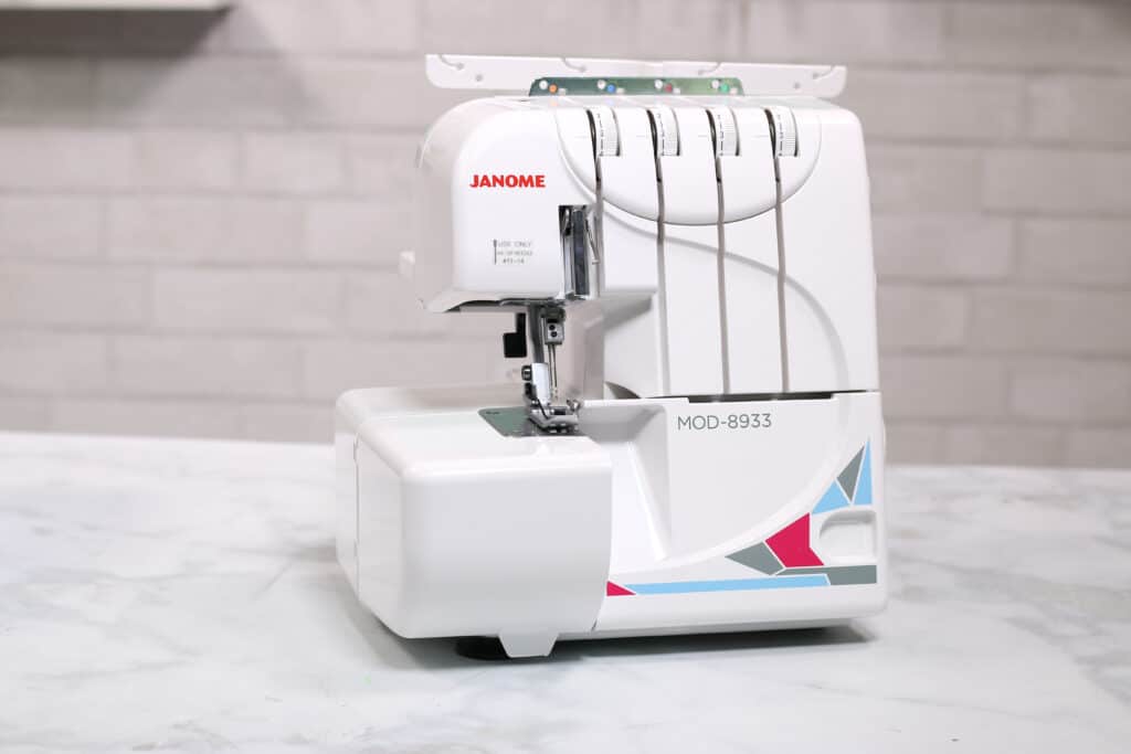 Janome MOD-8933 Serger | What is a Serger by popular US sewing blog, Sweet Red Poppy: image of a Janome MOD-8933 serger.
