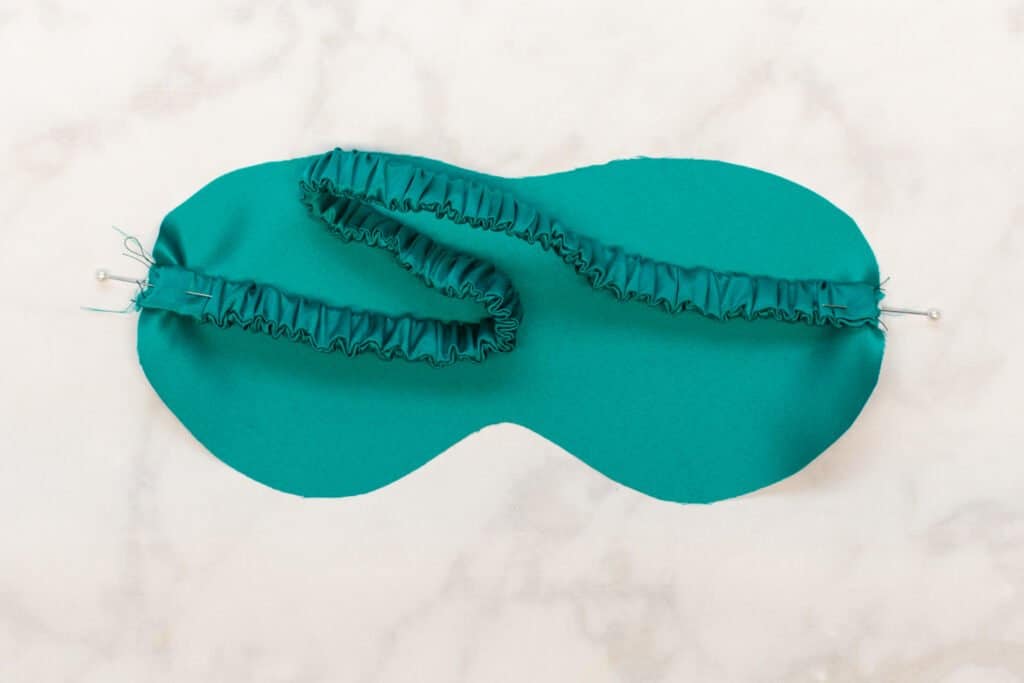 pin the strap to the sleep mask