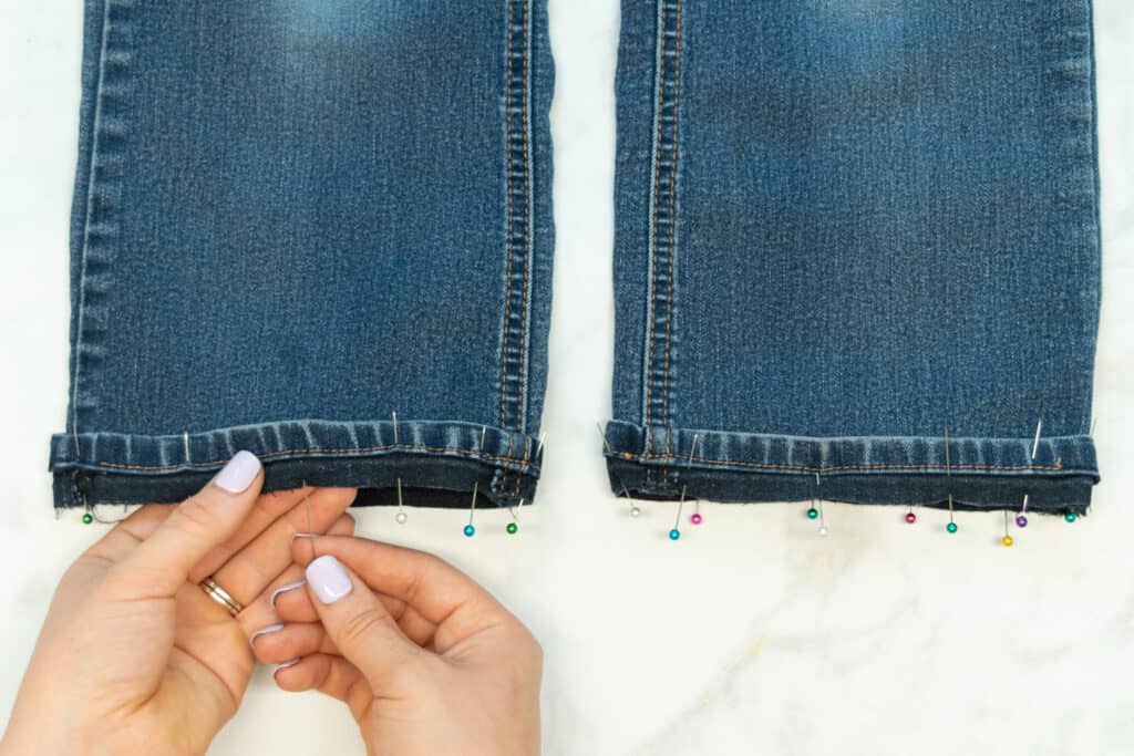 pin the original hem to the cut pantleg of flared jeans