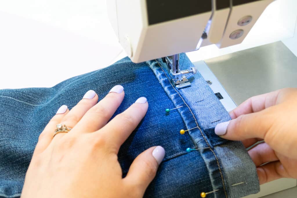 stitch the original hem to the pantleg of flared jeans