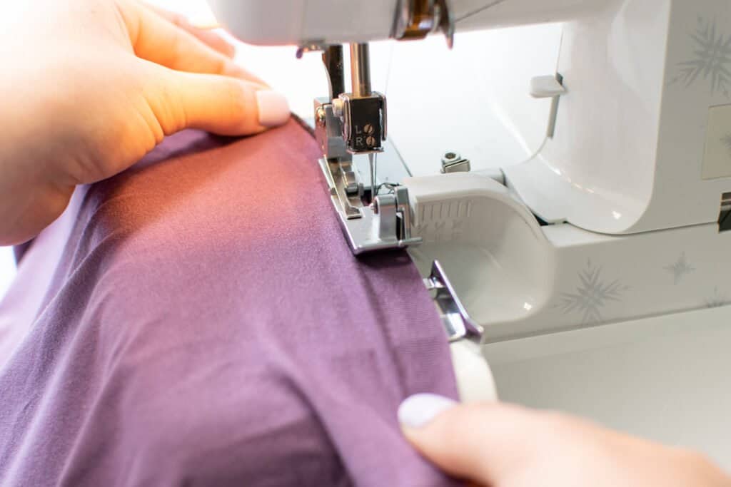 sew a lettuce hem by stretching the fabric on a serger
