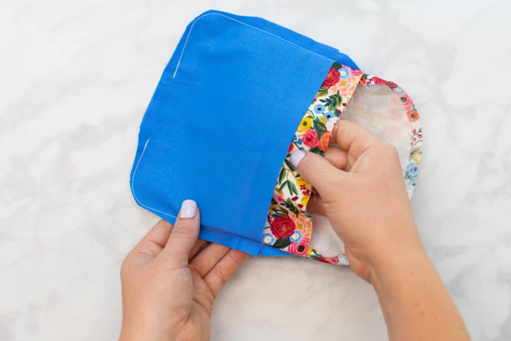 place the outer fabric glasses case inside the lining