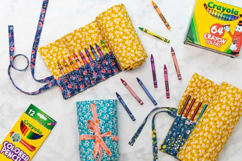 fill pencil and crayon rolls with crayola crayons and colored pencils