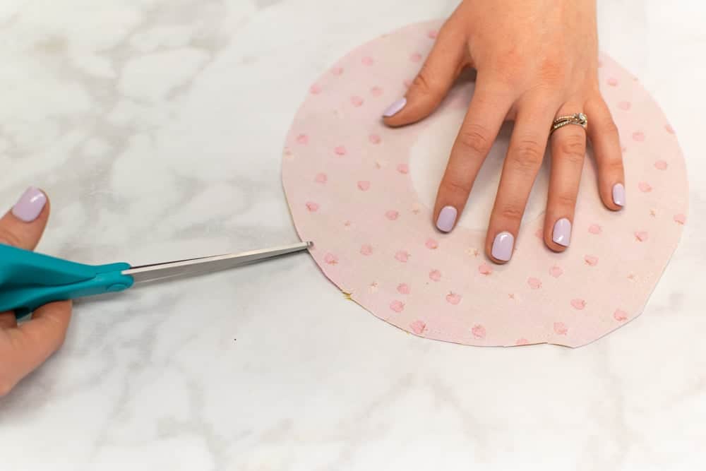 clipping the pocket seam allowances with a pair of turquoise scissors