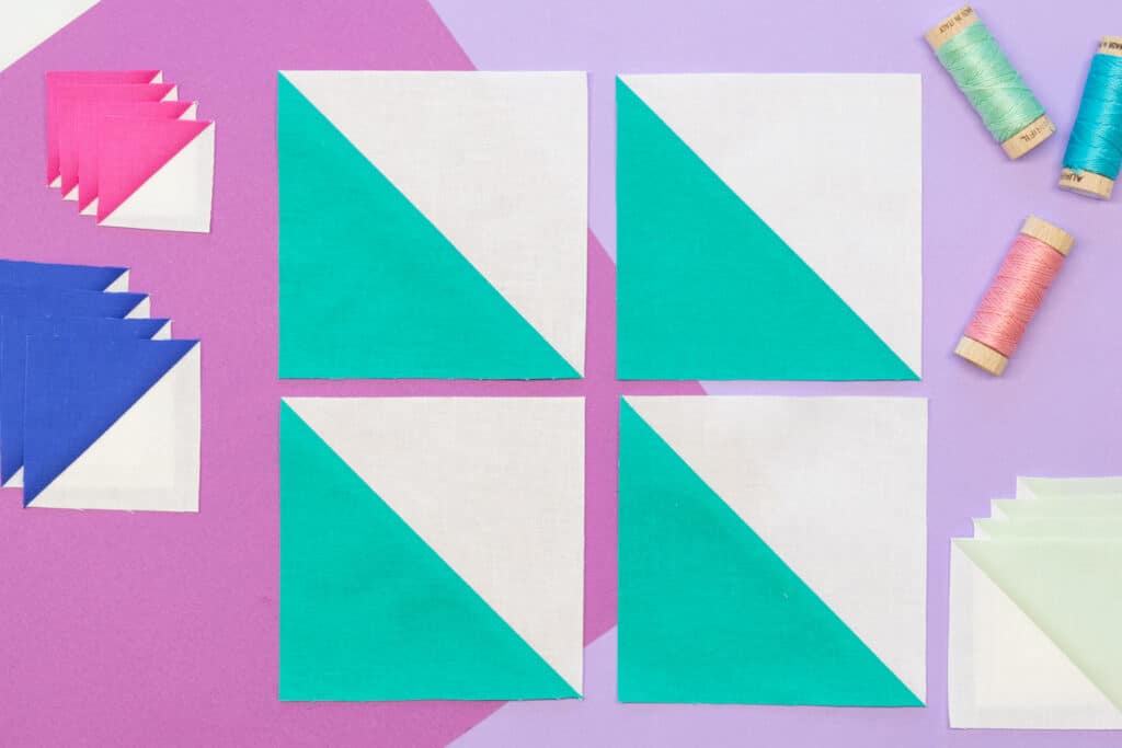4 green and white half square triangles