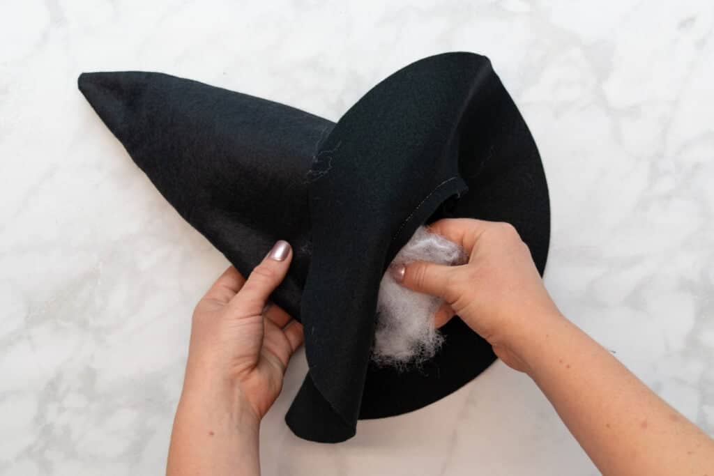 stuffing the witch hat with poly fil