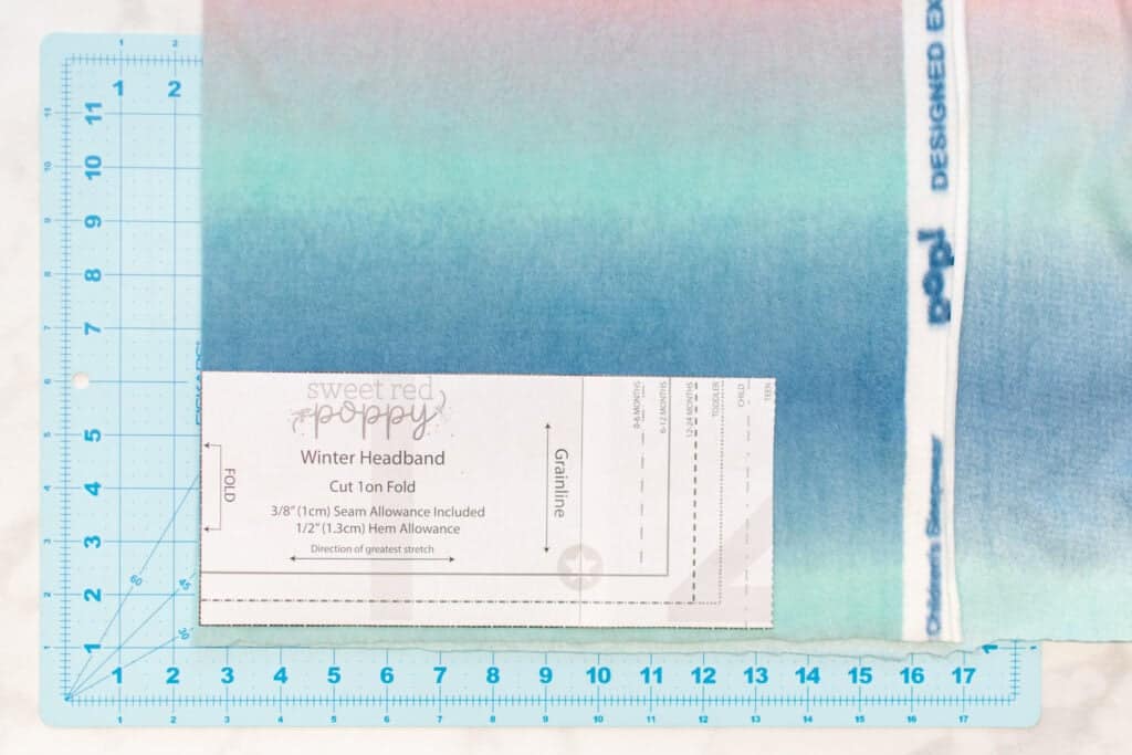 winter headband pattern laid out on ombre fleece fabric