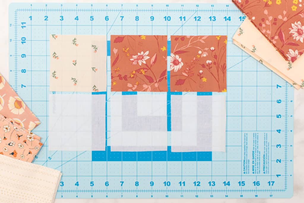 materials for corner bookmark cut out on a turquoise cutting mat